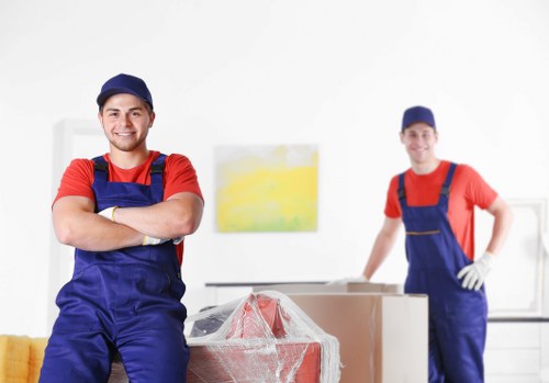 Careful loading of household items near a Holland Park property