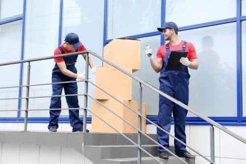 Office relocation planning in Holland Park with moving equipment and boxes