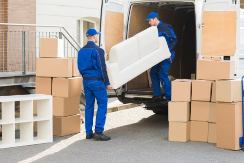 Removal team planning a home move on a quiet Holland Park street
