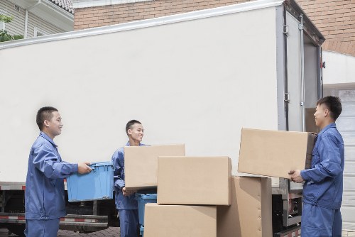 Local moving team handling boxes and household items