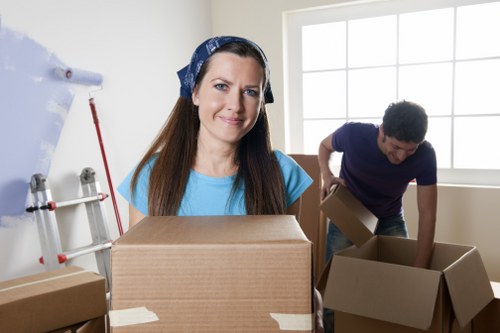 Household boxes and furniture ready for van transport