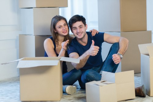 Moving day preparation with labelled boxes and packing materials
