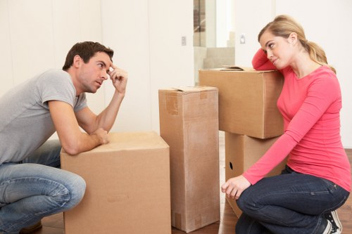 Professional movers handling a flat relocation in Holland Park