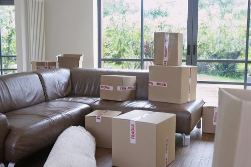 Packed office equipment ready for relocation in Holland Park