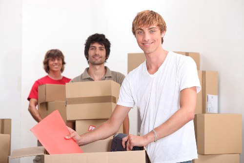 Packing and loading furniture into a removal truck in Holland Park