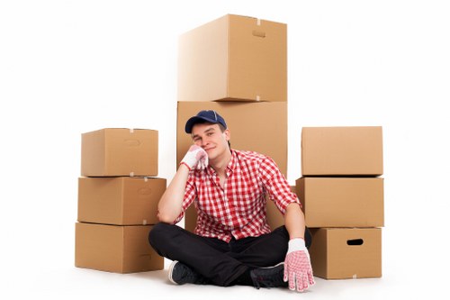 Local moving team handling boxes and furniture in West London
