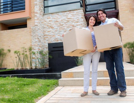 Professional movers preparing items for transport in Holland Park