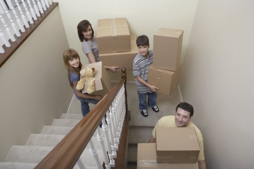 Professional movers loading items carefully into a van